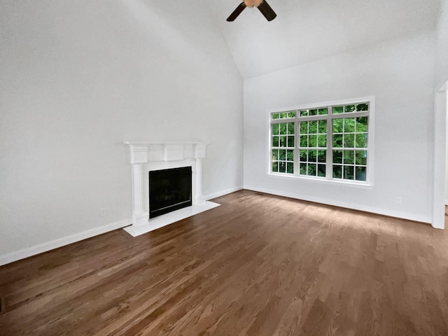 3047 Dogwood Trl, Spring Hill, TN 37174 - unfurnished living room with a ceiling fan, high vaulted ceiling, a fireplace with flush hearth, wood finished floors, and baseboards