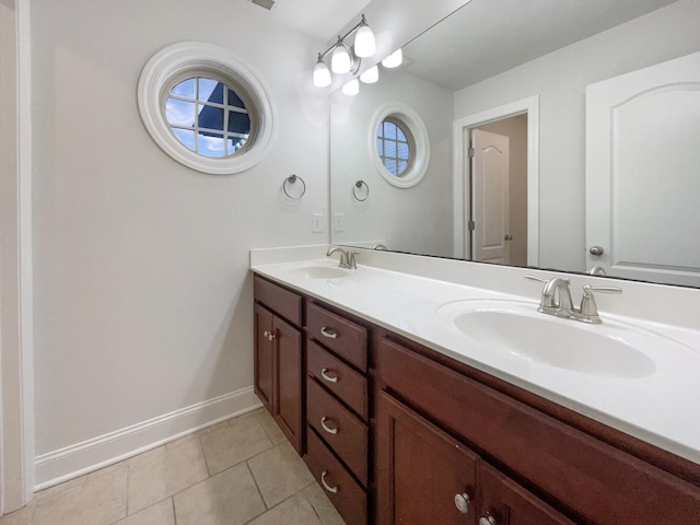 3047 Dogwood Trl, Spring Hill, TN 37174 - full bathroom with double vanity, tile patterned flooring, and baseboards