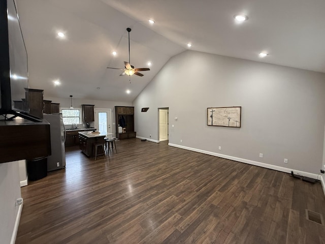 living room with sink, high vaulted ceiling, dark hardwood / wood-style floors, and ceiling fan