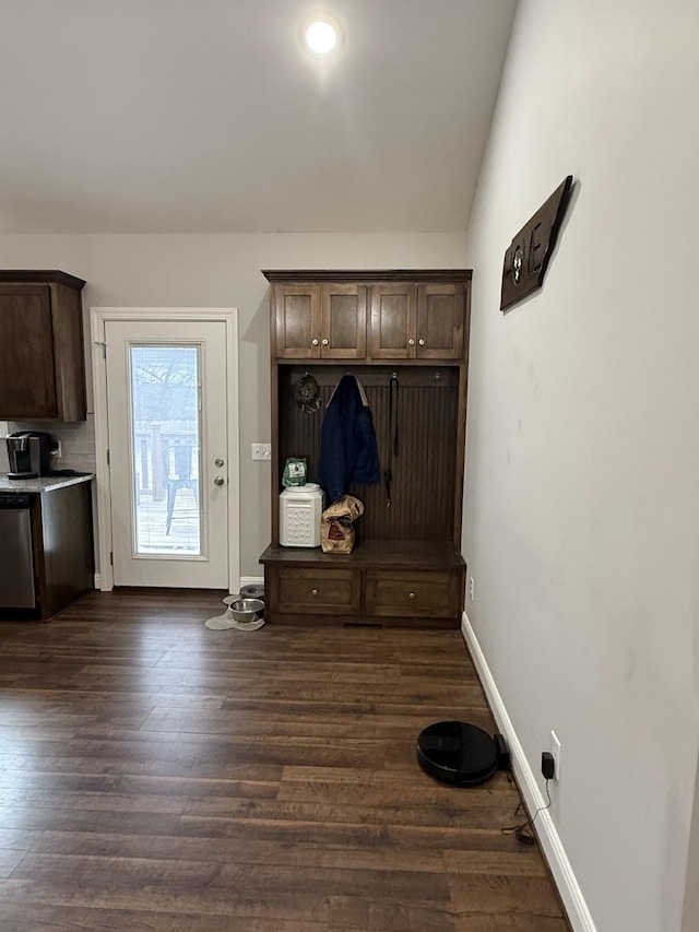 mudroom with dark hardwood / wood-style flooring and vaulted ceiling