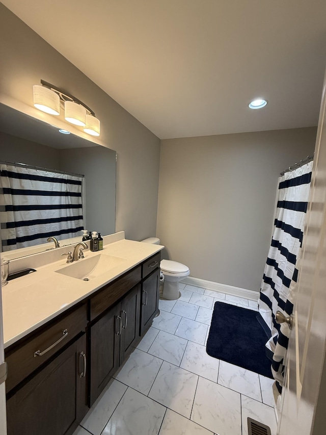 bathroom with vanity and toilet