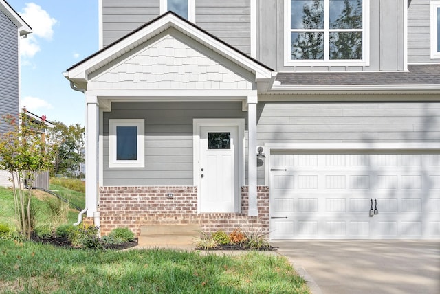 view of exterior entry with a garage