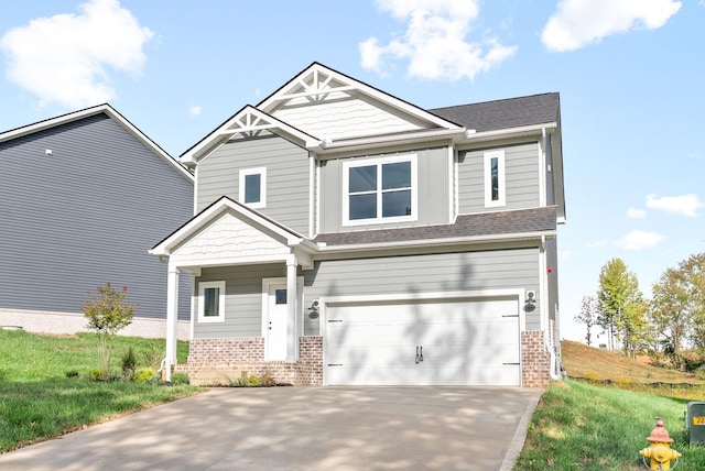 craftsman-style house featuring a garage and a front lawn