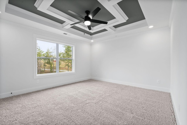 carpeted spare room featuring ceiling fan, ornamental molding, and coffered ceiling