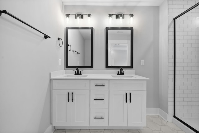 bathroom featuring an enclosed shower and vanity