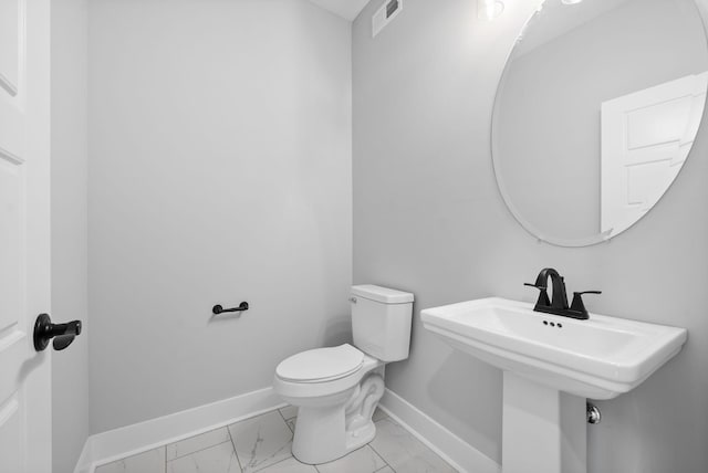 bathroom with sink and toilet