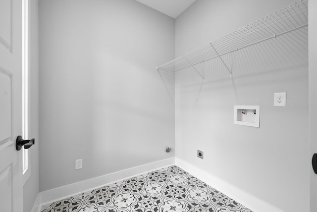 laundry area with electric dryer hookup, washer hookup, and light tile patterned floors