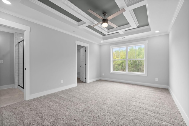 empty room featuring coffered ceiling, ornamental molding, light colored carpet, and ceiling fan