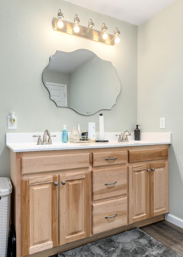 bathroom featuring vanity and hardwood / wood-style flooring