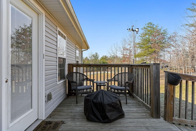 wooden deck with area for grilling