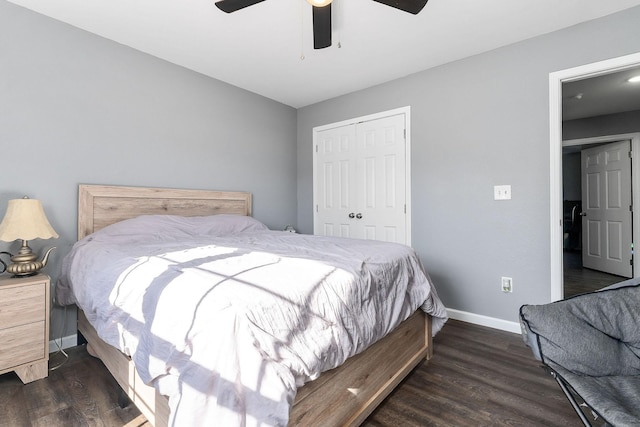 bedroom featuring dark wood-type flooring, a closet, and ceiling fan