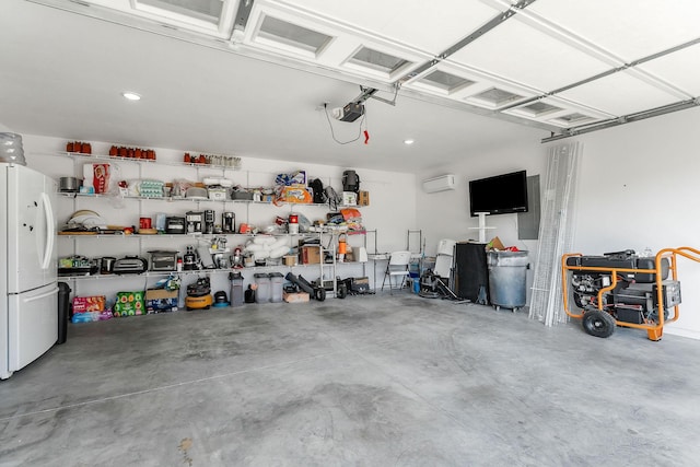 garage featuring white refrigerator, a garage door opener, and a wall unit AC