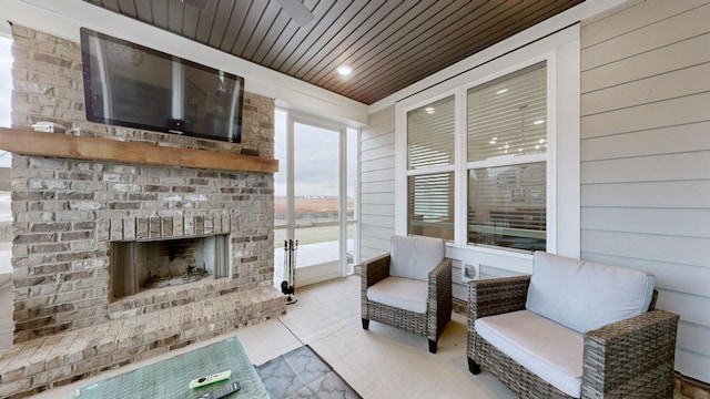 view of patio / terrace with an outdoor brick fireplace