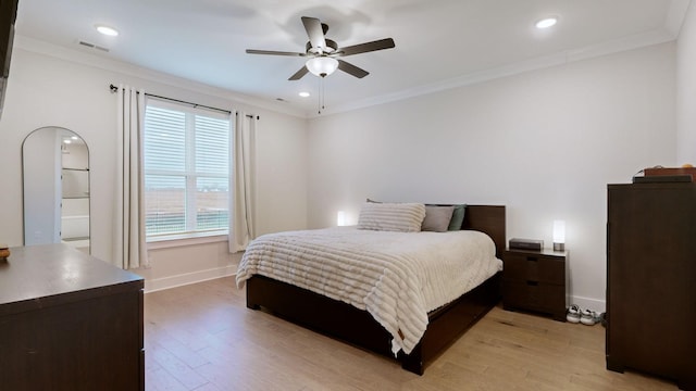 bedroom with crown molding, ceiling fan, and light hardwood / wood-style flooring