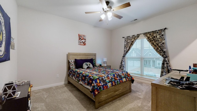 bedroom featuring light colored carpet and ceiling fan