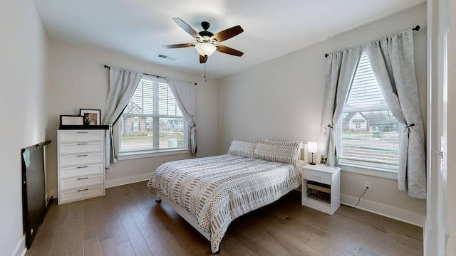 bedroom featuring dark wood-type flooring and ceiling fan