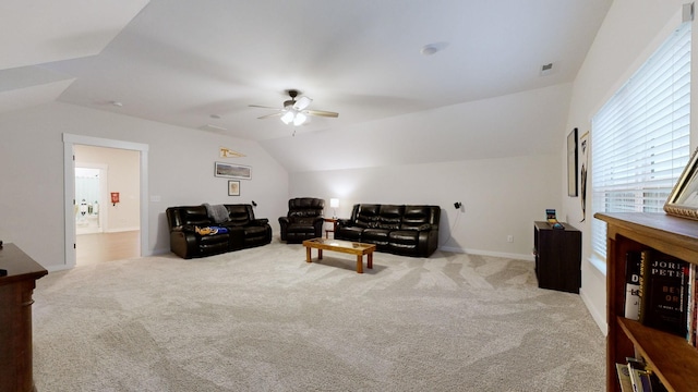 carpeted living room featuring ceiling fan and lofted ceiling