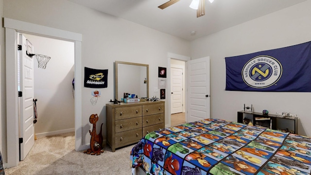 bedroom with ceiling fan and light colored carpet