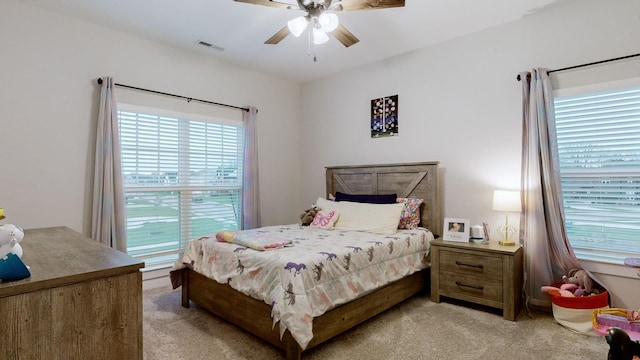 carpeted bedroom with ceiling fan