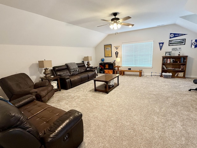 living room featuring ceiling fan, carpet flooring, and vaulted ceiling