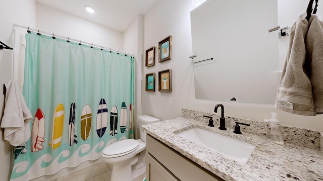 bathroom featuring tile patterned floors, vanity, toilet, and a shower with shower curtain