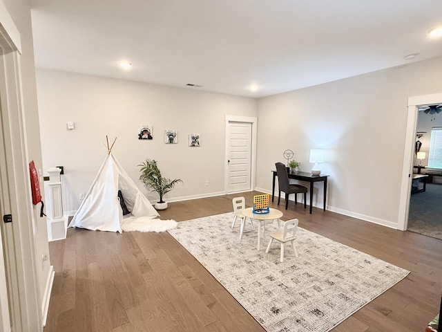 living area with dark hardwood / wood-style floors