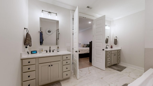 bathroom featuring vanity and crown molding