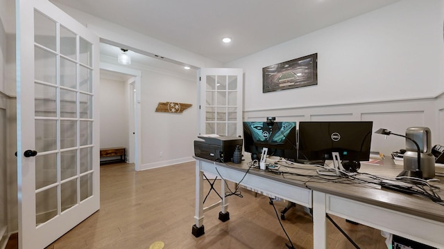 office featuring light hardwood / wood-style flooring and french doors