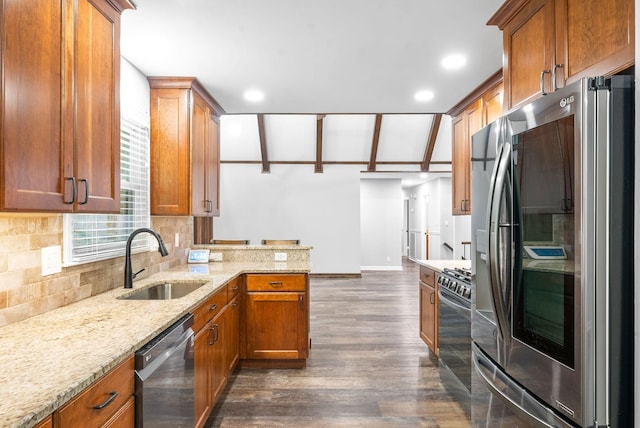 kitchen with sink, range with gas cooktop, dark hardwood / wood-style floors, stainless steel fridge, and dishwashing machine