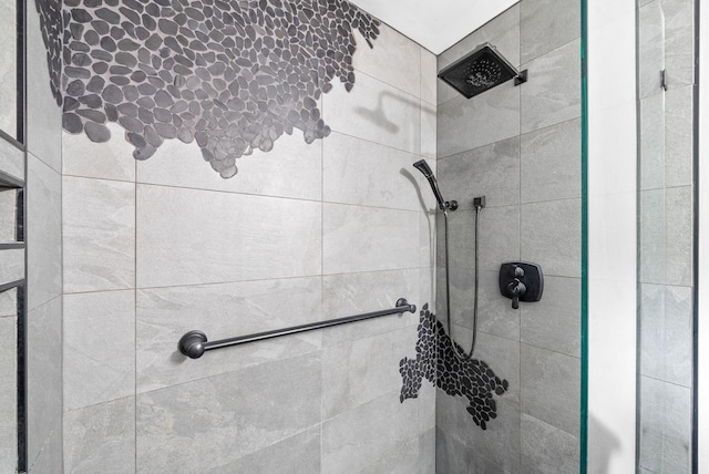 bathroom with a tile shower