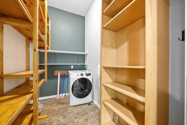 clothes washing area with washer / clothes dryer