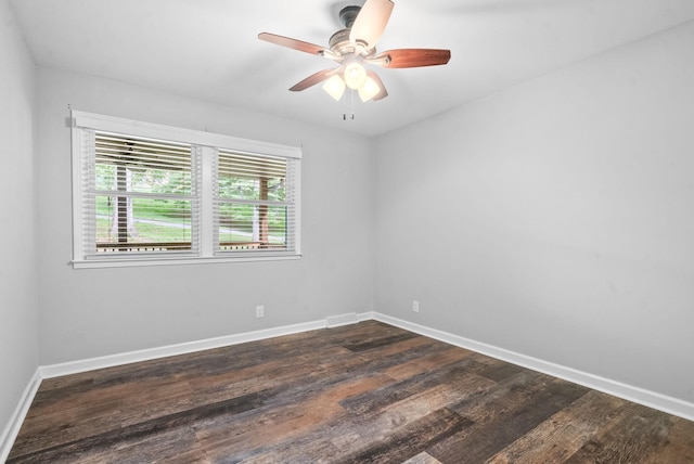 unfurnished room featuring ceiling fan and dark hardwood / wood-style floors