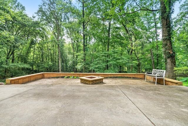 view of patio / terrace with a fire pit