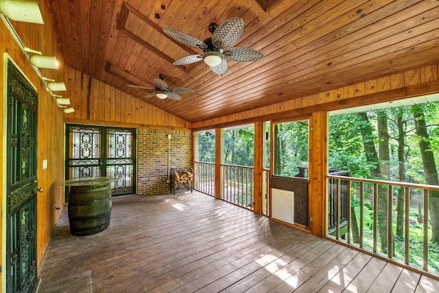 unfurnished sunroom with vaulted ceiling and wooden ceiling