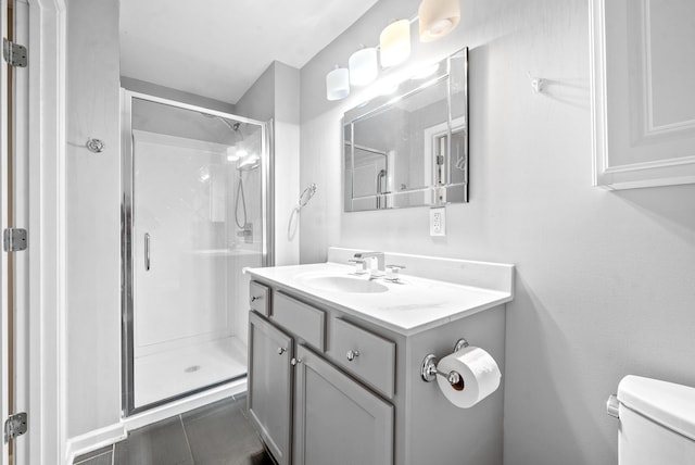 bathroom with vanity, an enclosed shower, tile patterned floors, and toilet