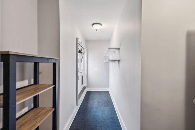 hall featuring dark colored carpet