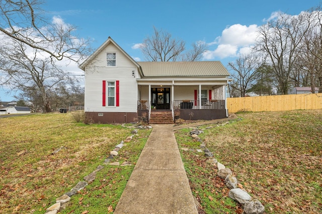 view of front facade with a porch and a front lawn