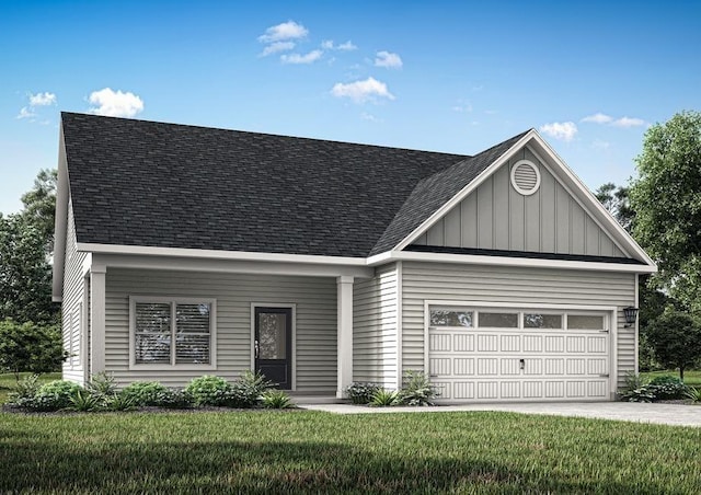 view of front of house featuring a garage and a front yard