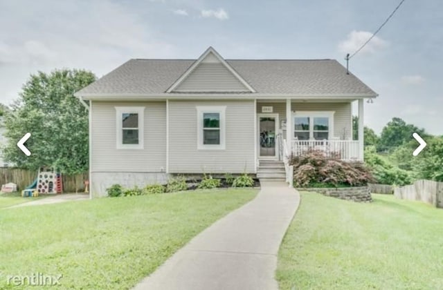 view of front facade featuring a front lawn and a porch