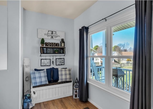 interior space featuring baseboards and wood finished floors