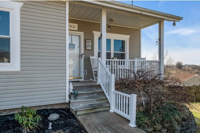 property entrance with covered porch