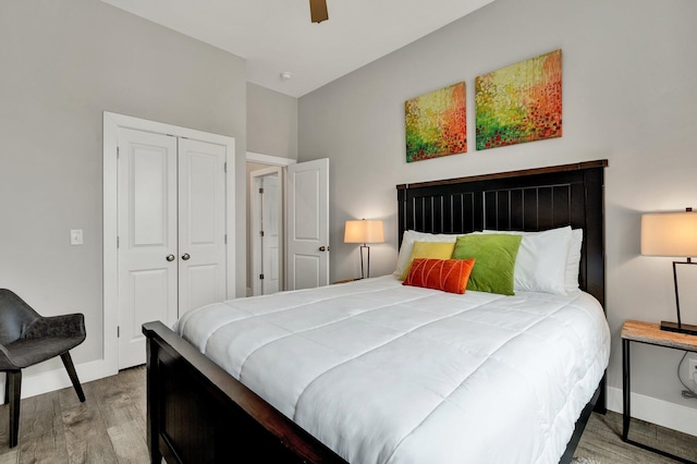 bedroom featuring a closet, ceiling fan, and light hardwood / wood-style flooring