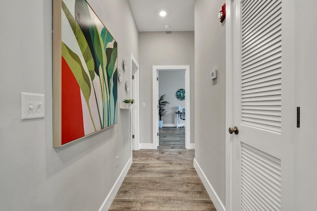 hallway with light hardwood / wood-style flooring