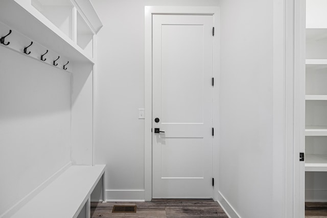 mudroom with dark hardwood / wood-style floors