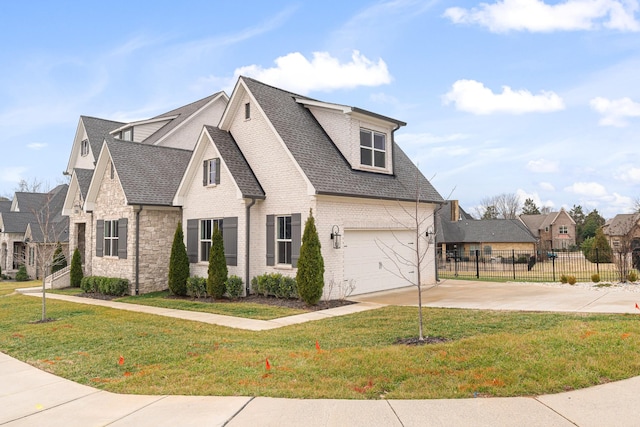 view of front of house featuring a garage and a front yard