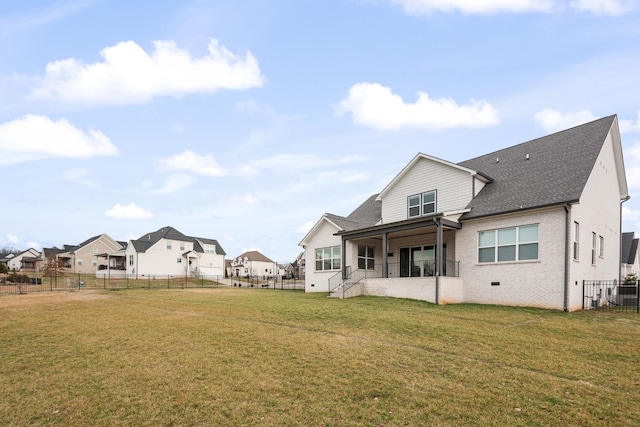 rear view of property featuring a yard and central AC unit