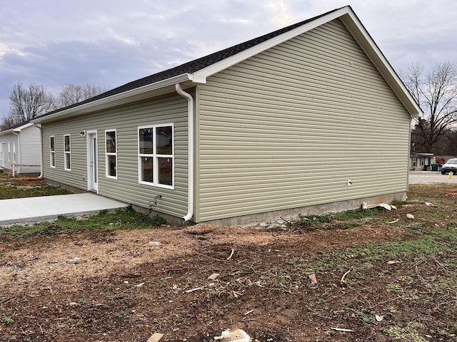 view of property exterior with a patio