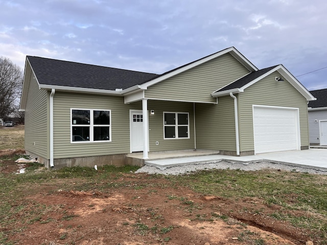 view of front facade featuring a garage and covered porch