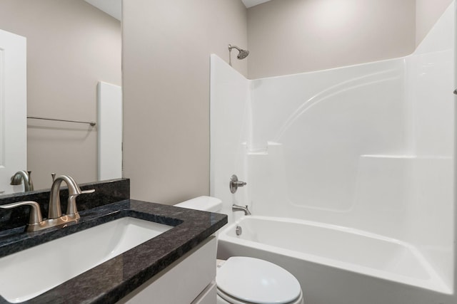 full bathroom featuring toilet, vanity, and shower / bathing tub combination