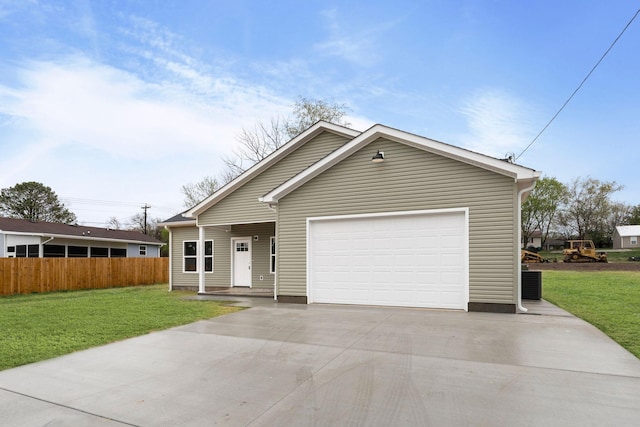 view of front facade featuring a front yard, concrete driveway, a garage, and fence
